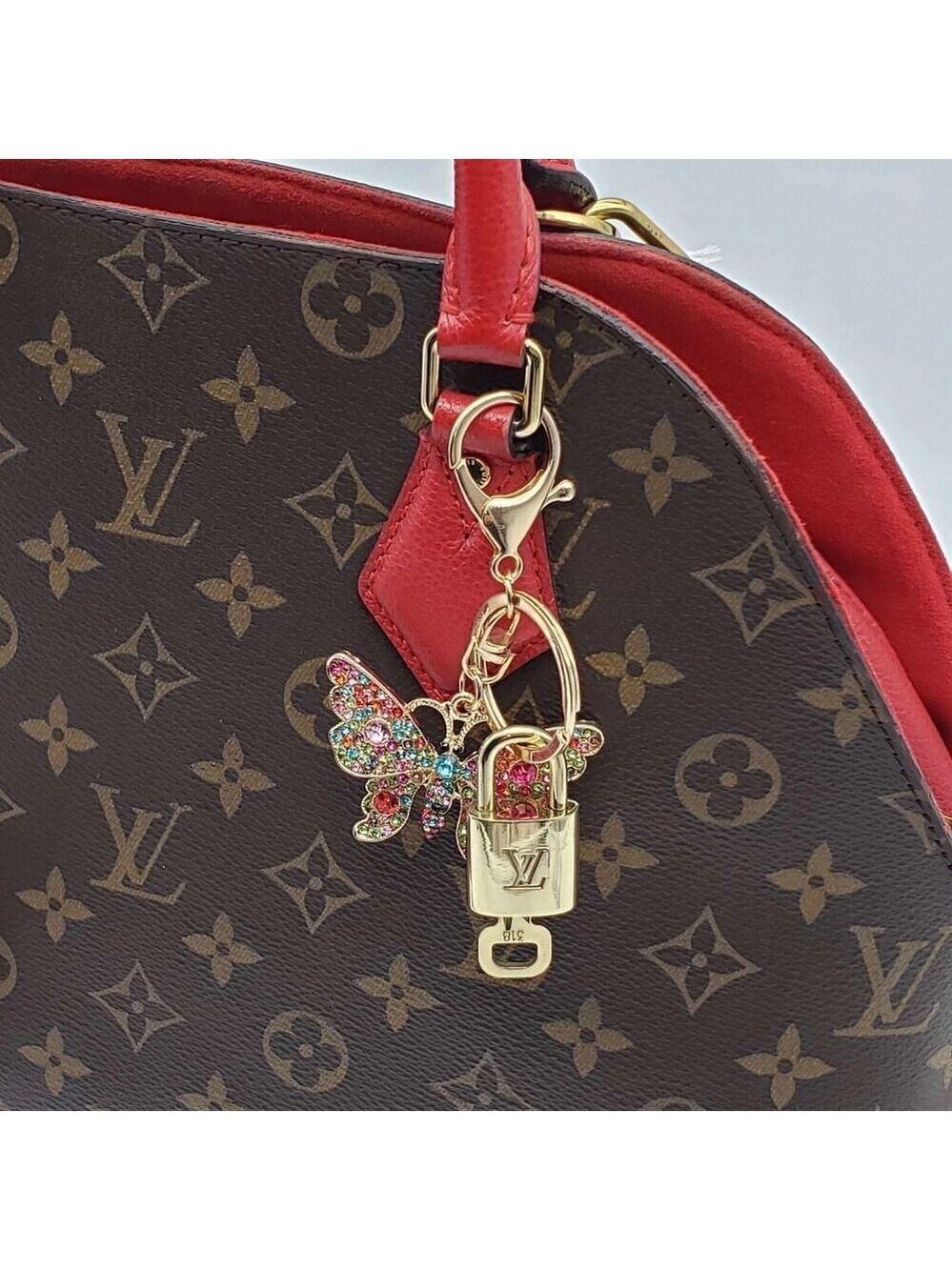 Authentic Louis Vuitton Lock & Key with unbranded Butterfly Bagcharm, Keycharm